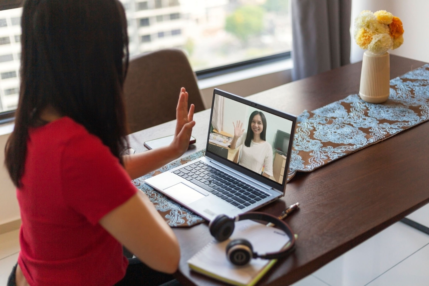 business colleague communicating via video call at home